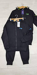 Чорний спортивний костюм для хлопчика кофта з капюшоном і штани під манжет в розмірі 140 і 146