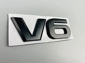 Декоративна металева наклейка, матовий чорний колір «V6», 85 мм х 32 мм х 3 мм DTL-2560