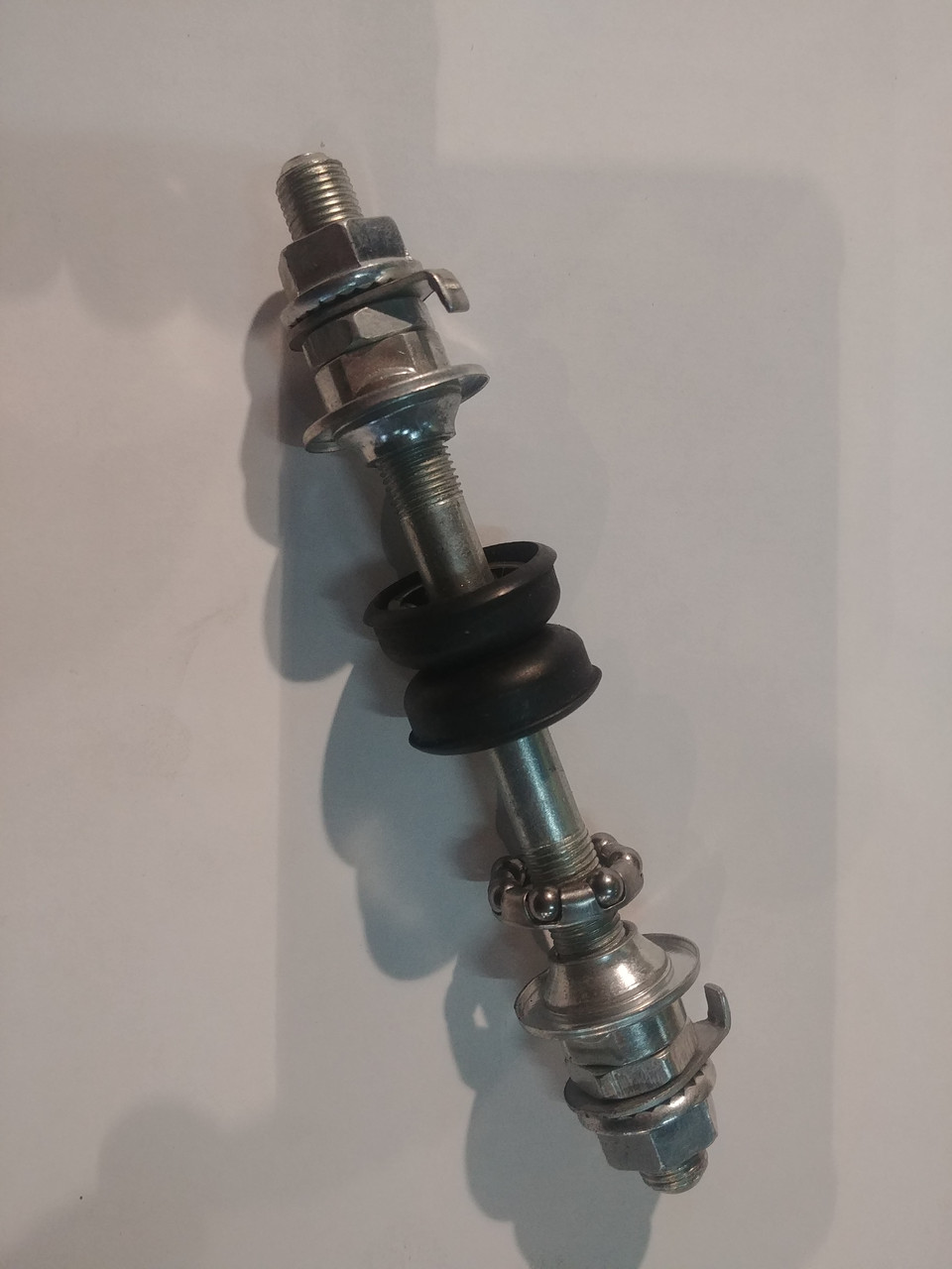 Вісь колеса переднього велосипедна (140мм, у зборі з чашками) FM