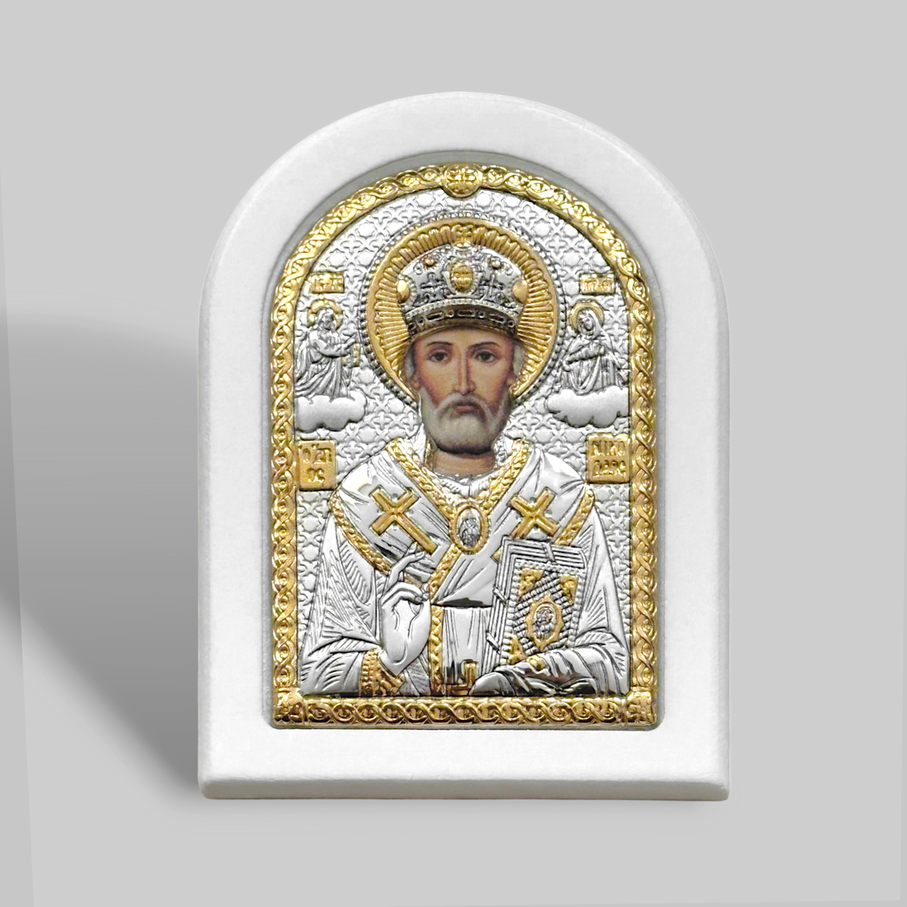 Ікона срібна 6,0х7,5 см. Лик прописаний. Біла рама. Срібло 925°, позолота. Святий Миколай Чудотворець.