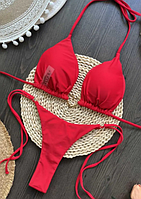 Роздільний жіночий купальник бікіні червоного кольору ліф на зав'язках