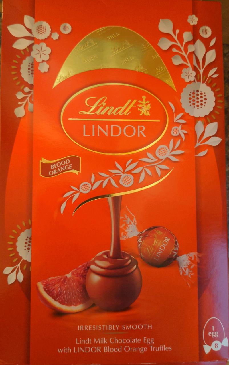 Шоколадне яйце з цукерками Lindt Lindor молочний шоколад з начинкою червоний апельсин 260г