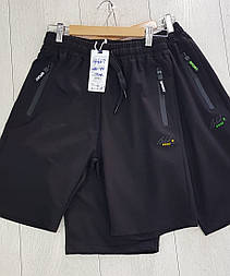 Трикотажні чорні спортивні шорти для хлопчика в розмірах 146 і 164
