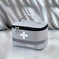 Зручна аптечка середнього розміру у формі валізки сіра