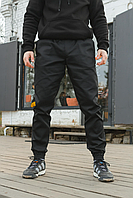 Чоловічі спортивні штани з бавовни з кишенями та манжетами.