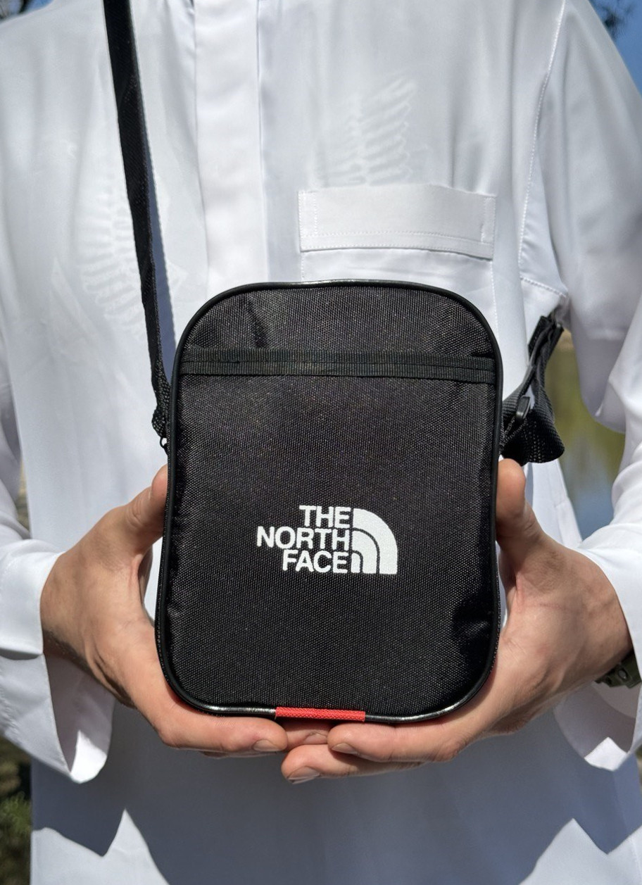 Повсякденна чоловіча сумка з кишенями та регульованим ременем  the north face