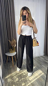 Чорні жіночі вільні штани на гумці