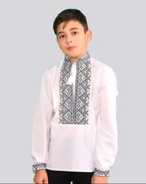 Вишиванка дитяча сорочка на хлопчика ляна у білому кольорі з оригінальним орнаментом. Розмір 98-134