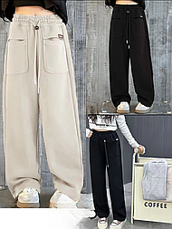 Широкі спортивні штани з кишенями в сірому кольорі