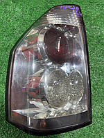 Ліхтар задній Лівий Mitsubishi Pajero Wagon III 00-07 б/у оригінал комплектація DAKAR ДЕФЕКТ