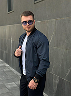 Красивий стильний однотонний темно-синій бомбер для чоловіків із плащової тканини.