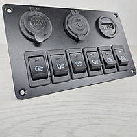 Панель із 6 перемикачами, двома USB-портами, цифровим вольтметром і розеткою прикурювача.