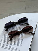 Сонцезахисні окуляри Dior для жінок. Очі від сонця з брендом. Безправні окуляри на середній особі.