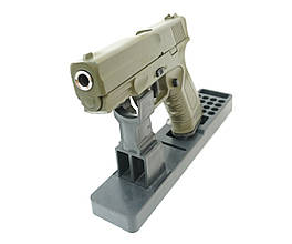 Пістолет Глок пружинний зелений металевий з ручним зведенням та пружинним механізмом