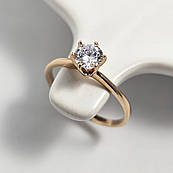 Золота каблучка з білим цирконом в центрі тонке