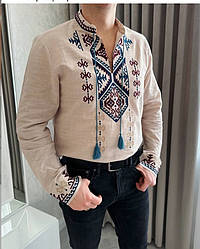 Чоловіча вишита сорочка бежевого кольору з різнокольоровою вишивкою розміри S, M, L, XL.