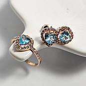 Комплект золотий каблучка та сережки з білими та блакитними фіанітами різної форми