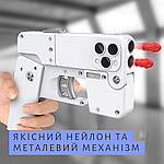 Складаний Іграшковий Нейлоновий Бластер Трансформер Телефон Пістолет Айфон ТОП Комплект Ivory, фото 6
