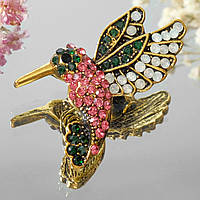Брошка на золотистій основі колібрі з різнобарвними кристалами, що переливаються, розмір 40х35 мм