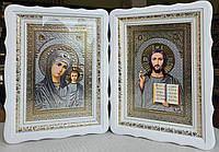 Иконы Спаситель и П.Б.Казанская в белом деревянном фигурном киоте под стеклом, киот 39*29,сюжет серебро 20х30