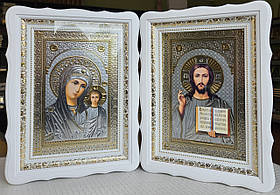 Ікони Спаситель та П.Б.Казанська в білому дерев'яному фігурному кіоті під склом, кіот 39*29, лік срібло 20×30