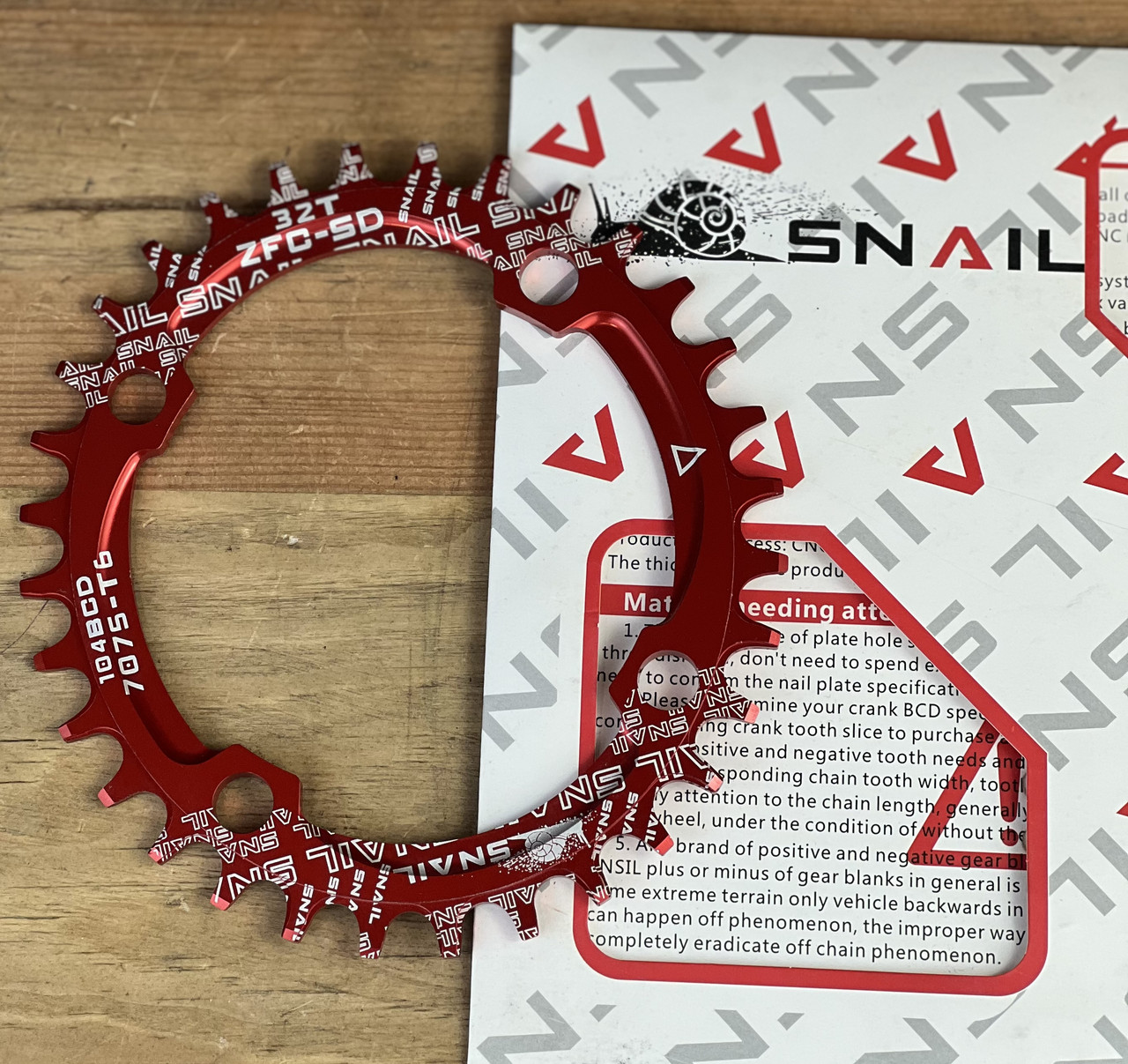 Зірка на велосипед неспадайка до шатуна NW AL 32T овал BCD 104 червоний SNAIL, фото 1