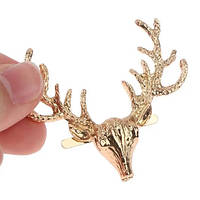 Декоративна брошка на сумку на вусиках Олень золотого кольору 60*50 мм