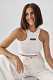 Приталений жіночий топ у рубчик молочний трикотажний спортивний топік для фітнесу, фото 2