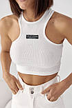 Приталений жіночий топ у рубчик молочний трикотажний спортивний топік для фітнесу, фото 5