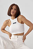 Приталений жіночий топ у рубчик молочний трикотажний спортивний топік для фітнесу, фото 6