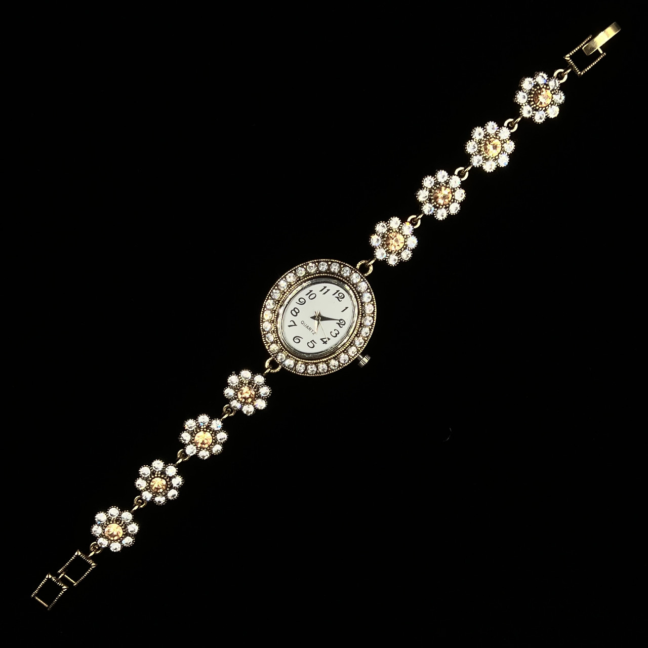Женские часы винтажные круглые кварцевые в золотистом цвете с белыми и бежевыми стразами длина 19 см - фото 1 - id-p2633646399