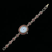 Женские часы винтажные овальные кварцевые в золотистом цвете с красными переливающимися стразами длина 19 см