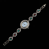 Женские часы винтажные овальные кварцевые в золотистом цвете с разноцветными камушками длина 19 см