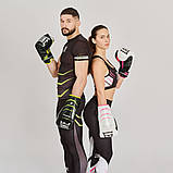 Боксерські рукавиці Leone GN110F, Чорні, шкіряні, 10 унцій (283г.) для спортсменів від 8 років до 60 кг. + бинти, фото 10