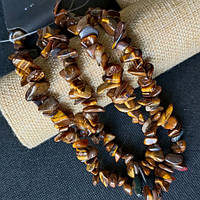 Бусини тигрове око 12х5 мм 80 см саморідки неправильної форми