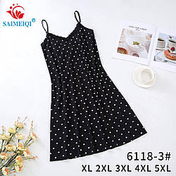 Жіноча нічна сорочка на тонкій бретельці завдовжки нижче коліна. Трикотаж