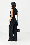 Трикотажний літній жіночий костюм з блузою і прямими брюками чорний брючний костюм з легкої тканини розмір S, фото 2