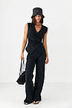 Трикотажний літній жіночий костюм з блузою і прямими брюками чорний брючний костюм з легкої тканини розмір S, фото 5