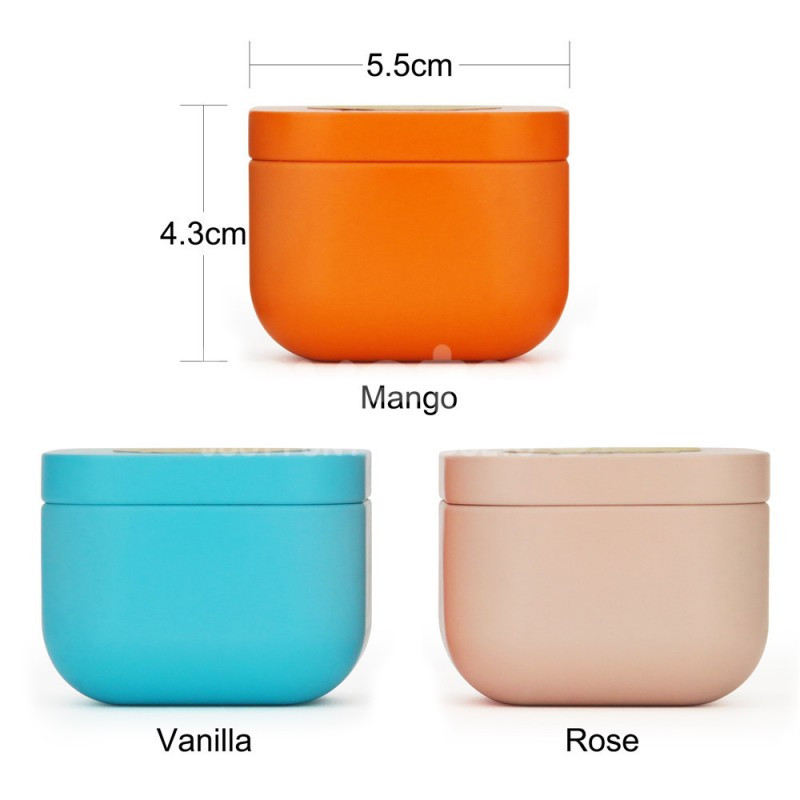 Три масажні свічки Hush: блакитна (Vanilla), помаранчева (Mango), світло-рожева (Rose), крупний план