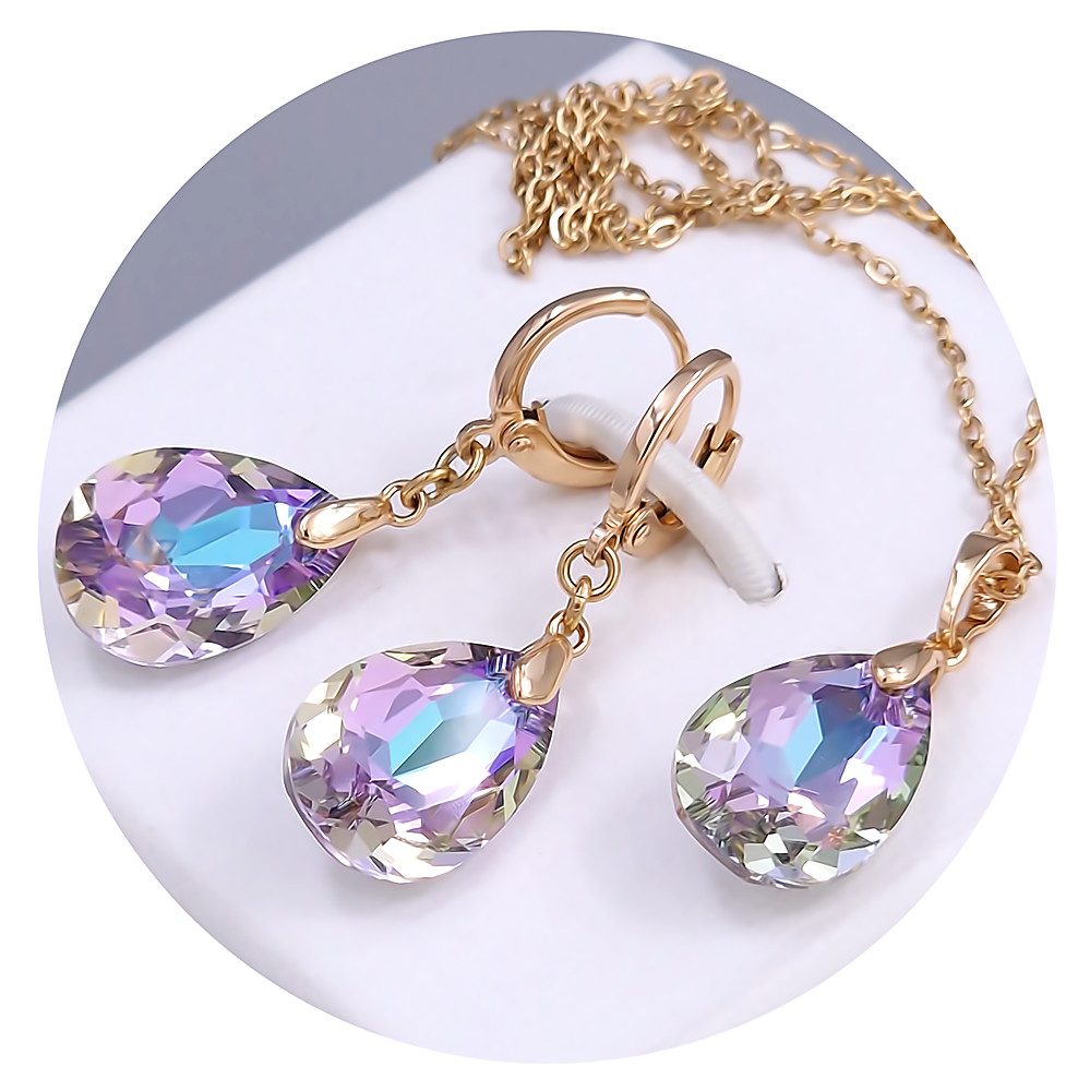 Набір ХР. Сережки та кулон на ланцюжку зі Swarovski бузкового кольору. Позолота 18К Ланцюжок: 40-45 см. Сережки: 35 мм.
