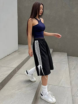 Модні довгі шорти для дівчинки підлітка