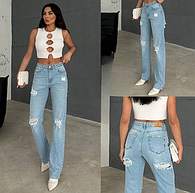 Жіночі рвані джинси блакитного кольору прямого крою звужені донизу