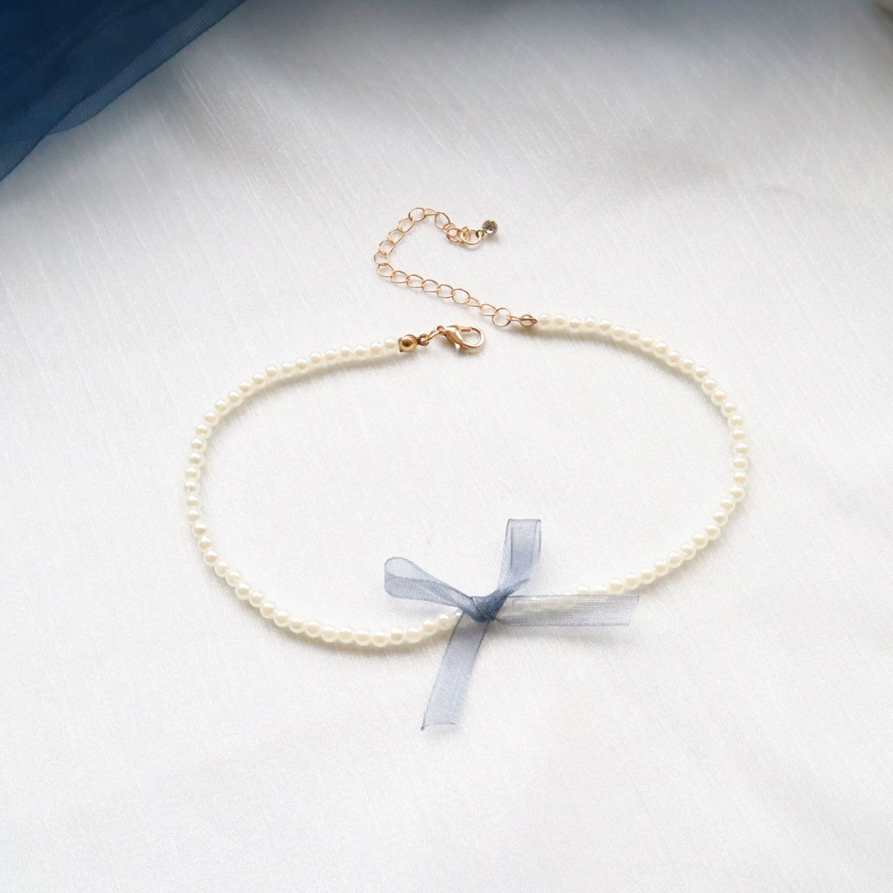 Ніжний чокер з перлинами та бантиком блакитного кольору., фото 1
