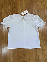 Опт блуза біла дитяча з коротким рукавом Брош р 116-140 біла
