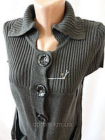 Жіноча в'язана накидка без рукавів.