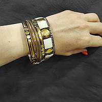 Комплект INDIRA із п'яти жіночих металічних браслетів золотистих