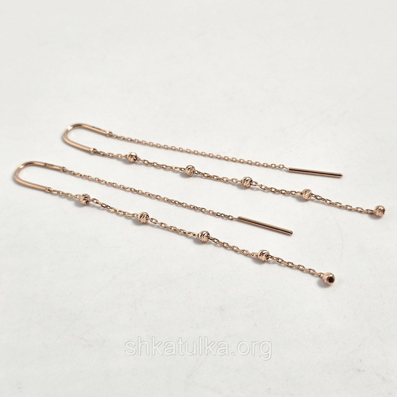 Сережки протяжки золоті із золотими намистинами на ланцюжках без каменів