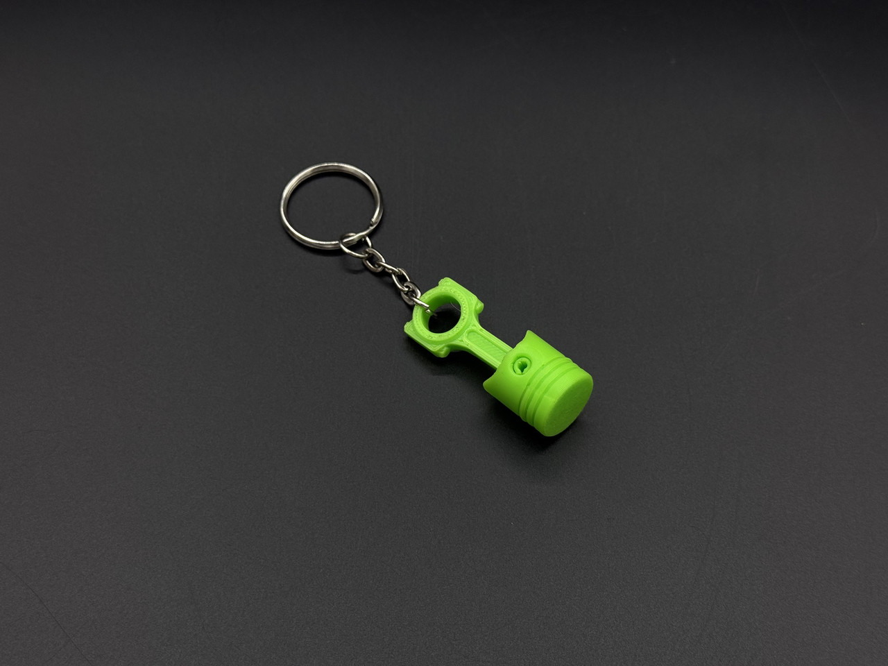 Брелок-підвіска для ключів сумки рюкзака 3D Поршень салатовий. 42х16мм, фото 1