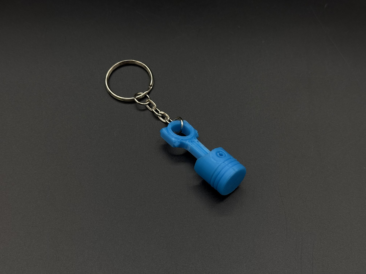 Брелок-підвіска для ключів сумки рюкзака 3D Поршень блакитний. 42х16мм, фото 1