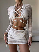 Комплект купальник зі спідницею та топом з довгим рукавом. Купальник регулюється зав'язками